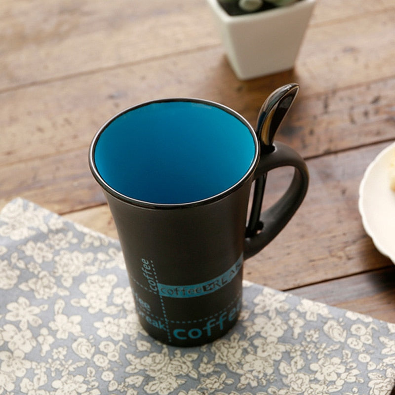 simple ceramic coffee mug with spoon